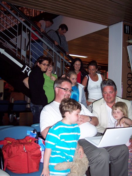 Holiday's over. Looking at pictures in the airport